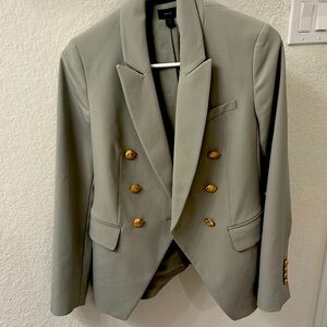 Light green double breasted blazer size XS
In good condition